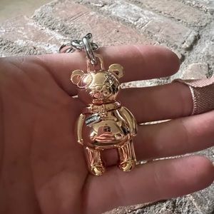 This teddy bear keychain from Coach. Rose gold